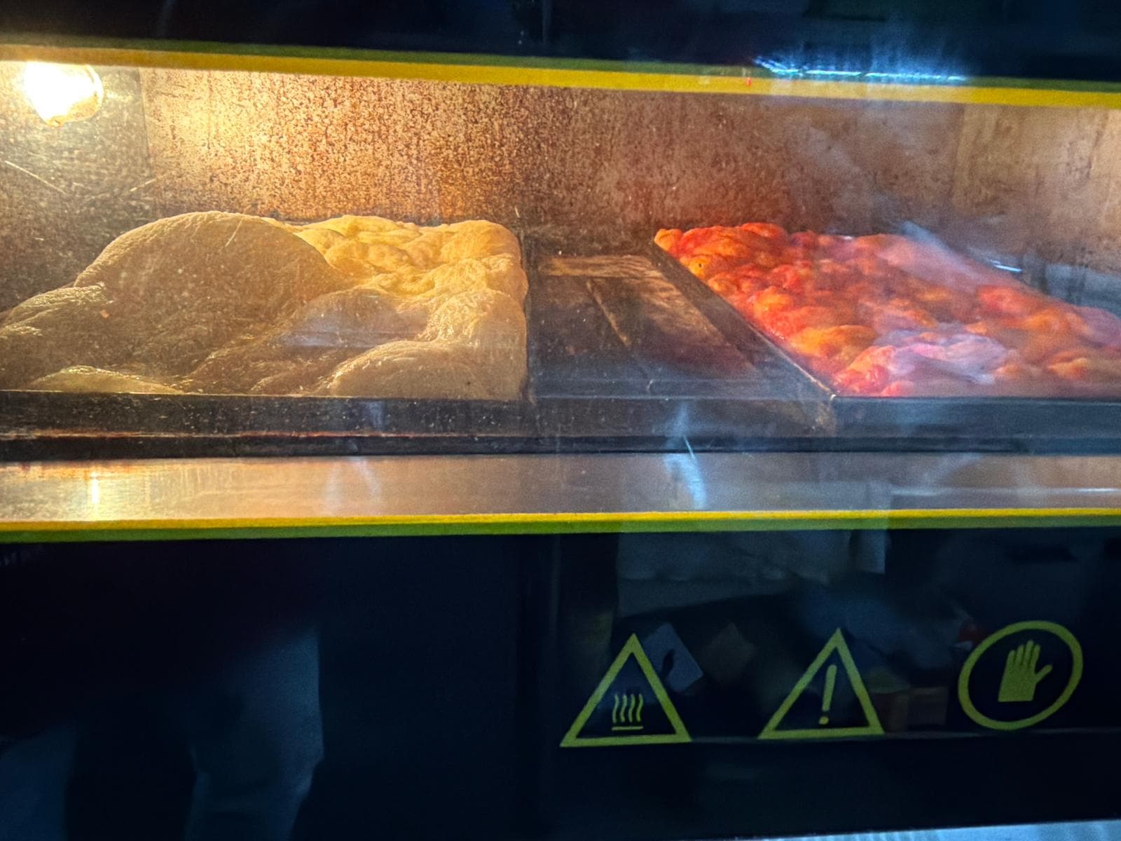 Looking through the oven glass into the bakery